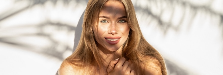 image of a young woman standing out in the sun